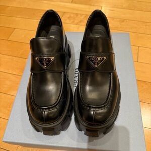 Prada black lug sole platform loafers